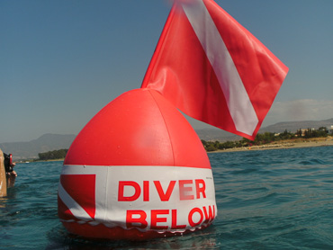 Amphitheatre sea diver below sign at sea level